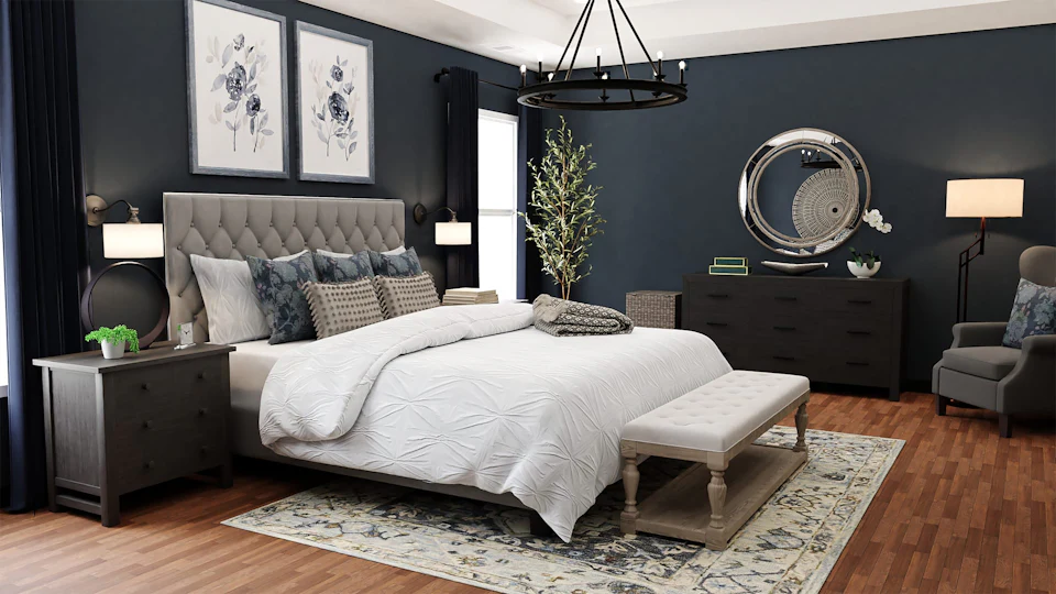 Bedroom with a navy accent wall, tufted headboard and crisp white bedding
