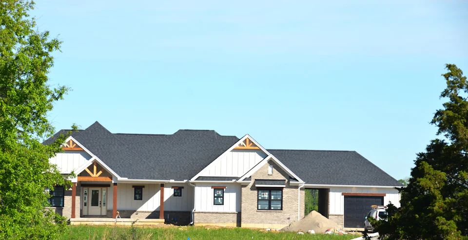 New construction craftsman-style home with gabled rooflines