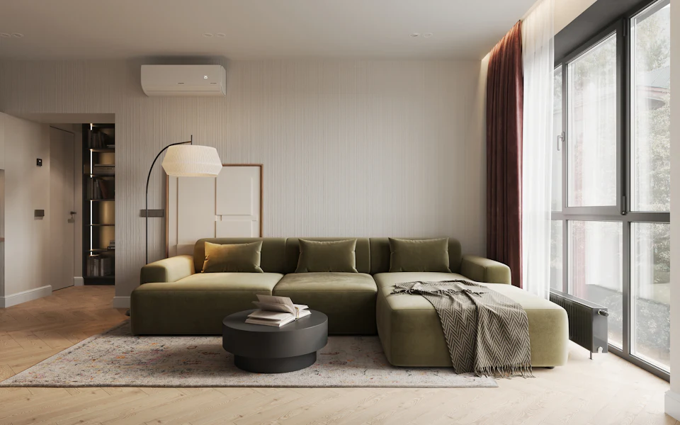 After staging — Minimal condominium living room with an olive sectional and tall windows
