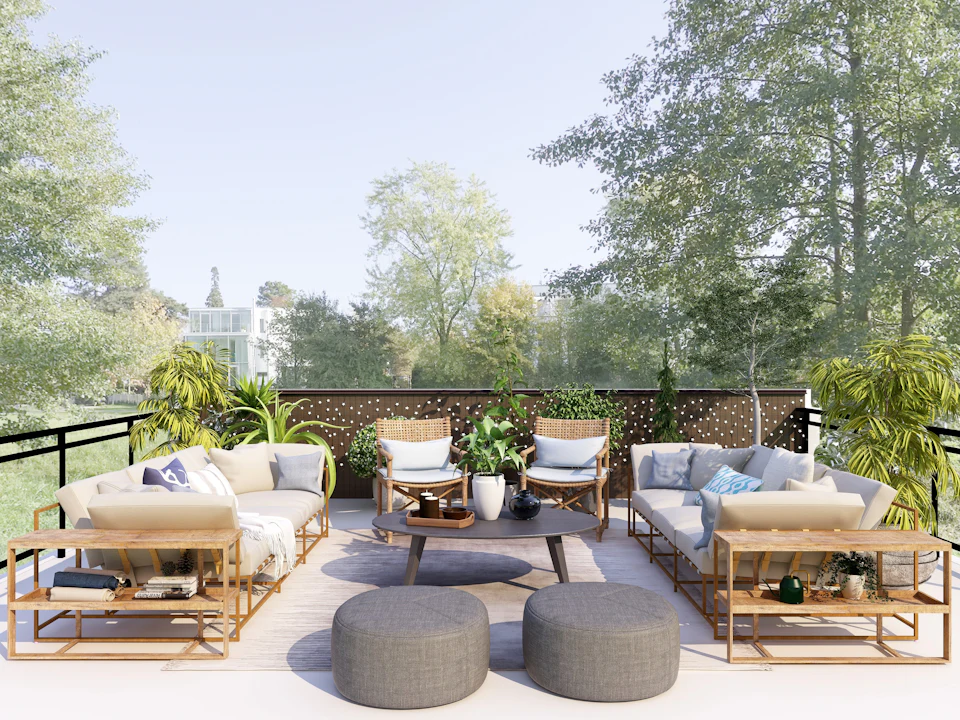 Garden terrace with outdoor sofas, ottomans and lush greenery